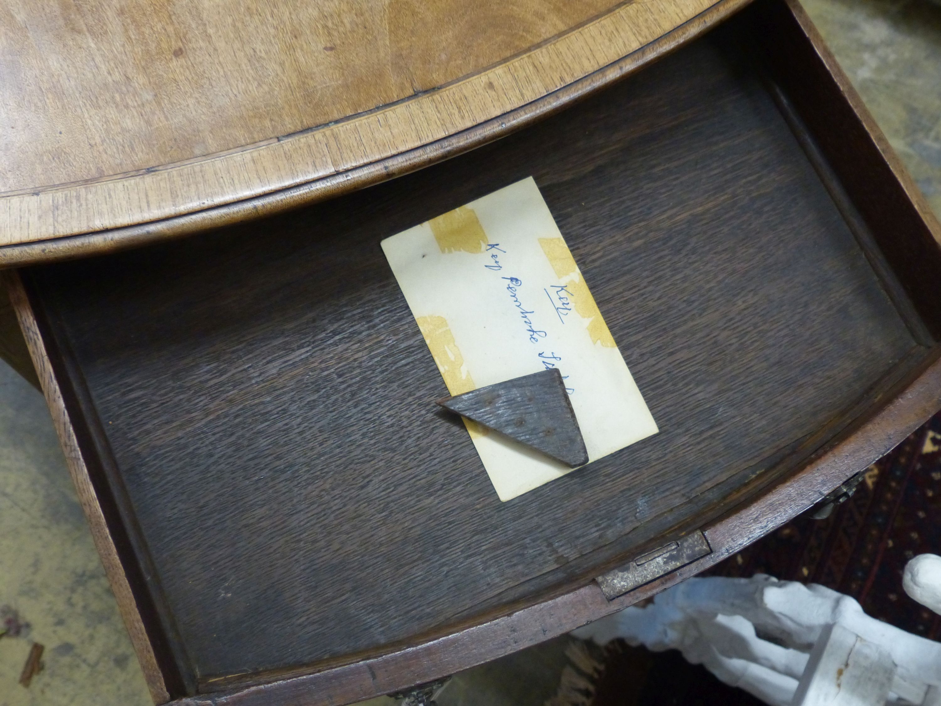 A George III mahogany oval pembroke table